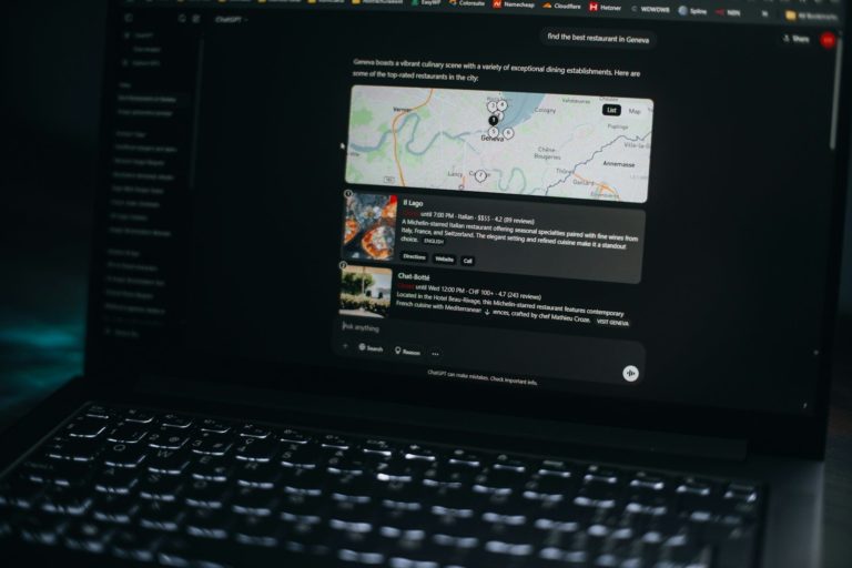 Laptop screen shows a map and related information.