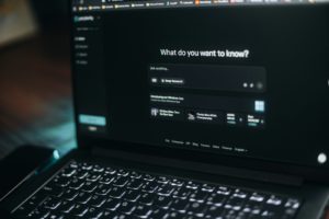 Laptop screen showing a search bar.