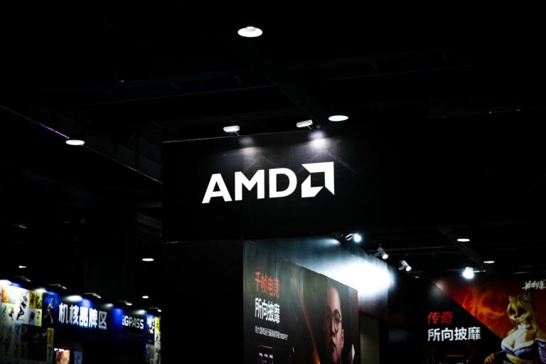 Amd logo illuminated on a dark ceiling