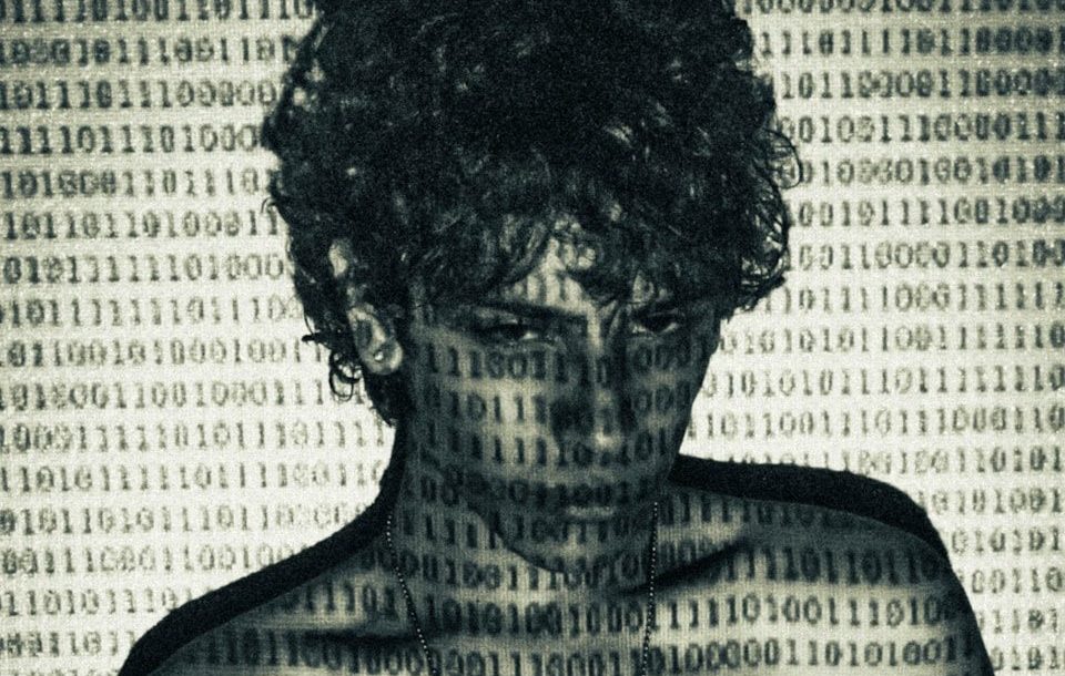 Man with binary code overlay on body and behind him