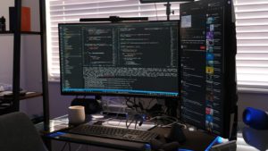a computer monitor sitting on top of a desk