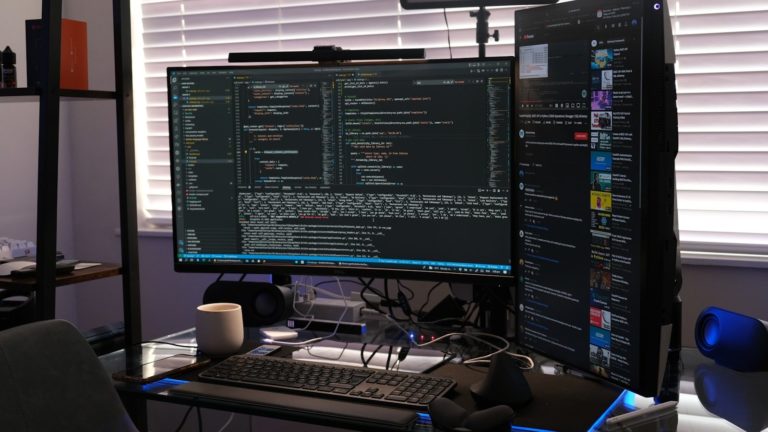 a computer monitor sitting on top of a desk